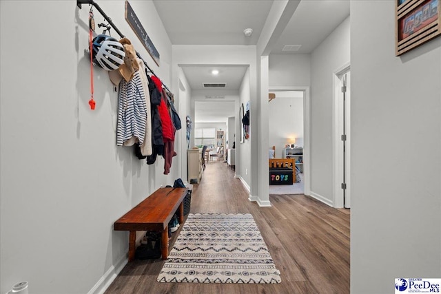 2025 Eastpark Dr, Darlington, SC 29532 - hallway featuring baseboards, wood finished floors, and visible vents