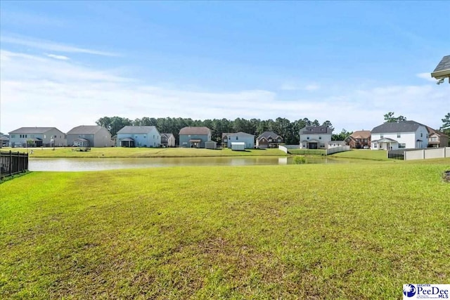 1814 Lake Blalock Dr, Florence, SC 29506 - view of grassy yard featuring a residential view and a water view