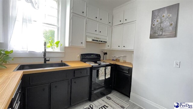 kitchen with white cabinets, butcher block counters, sink, and black appliances