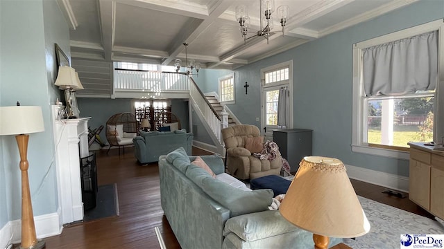 living room with coffered ceiling, dark hardwood / wood-style floors, and a chandelier