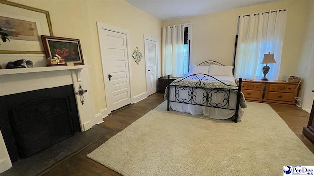 bedroom featuring dark wood-type flooring