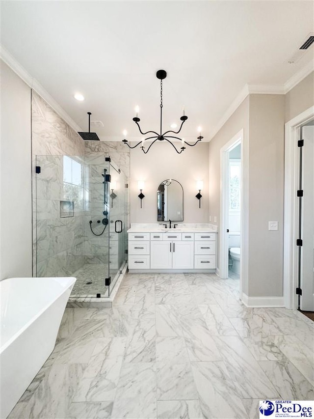 full bath featuring marble finish floor, a marble finish shower, a freestanding tub, and crown molding