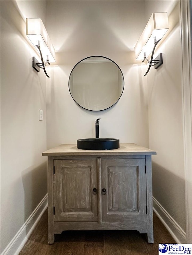 bathroom with vanity and baseboards