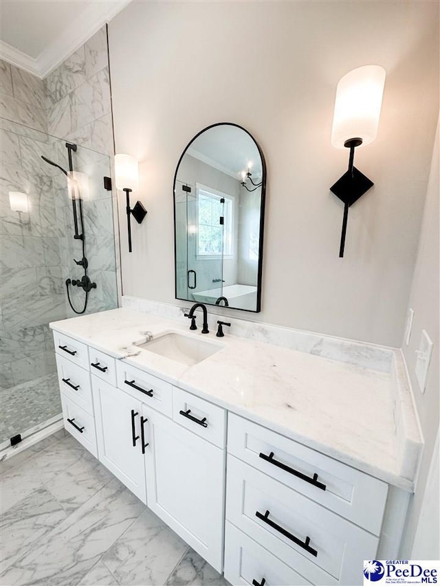 full bathroom with marble finish floor, ornamental molding, a marble finish shower, and vanity