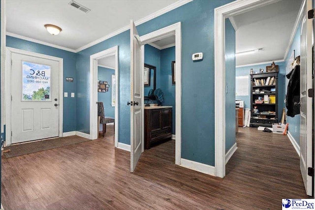 entrance foyer featuring ornamental molding and dark hardwood / wood-style floors