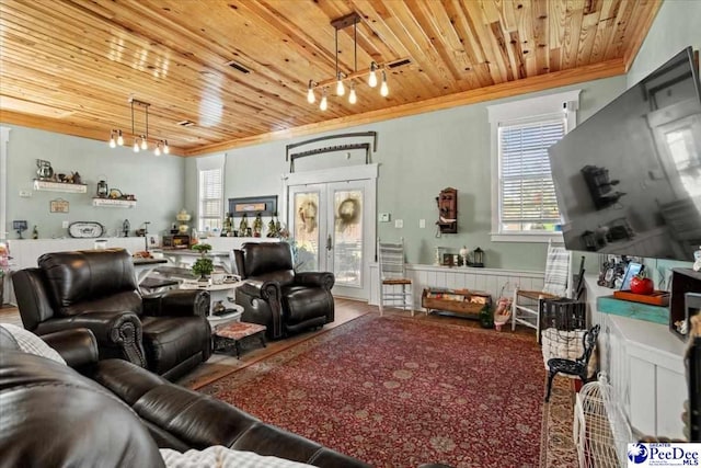 living room featuring ornamental molding, rail lighting, wood ceiling, and french doors