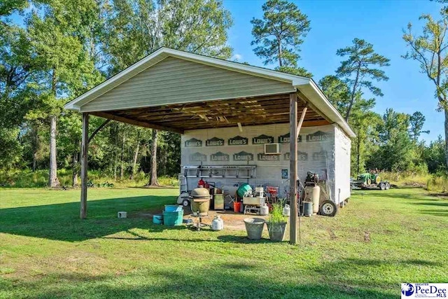 view of outdoor structure featuring a lawn