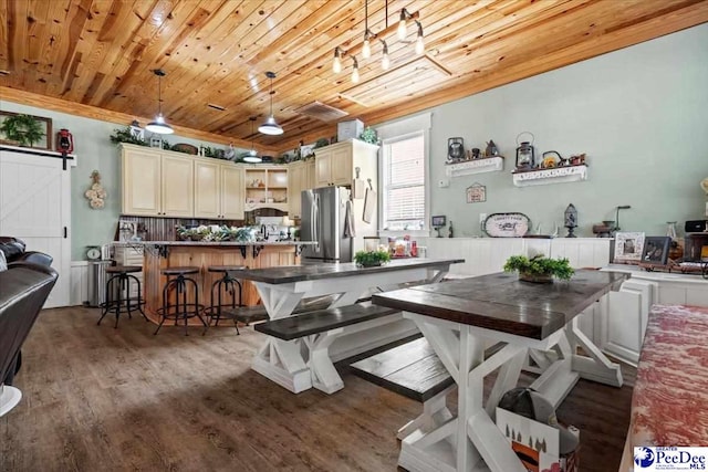 dining space featuring hardwood / wood-style flooring and wooden ceiling