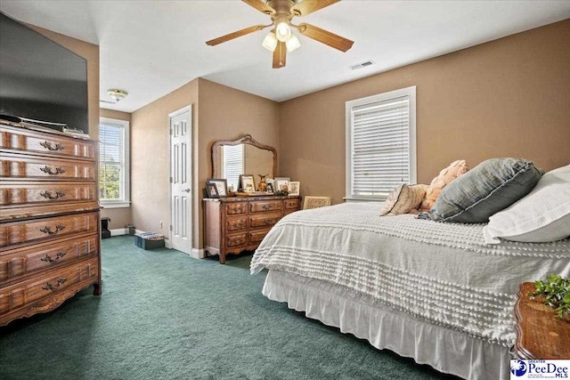 carpeted bedroom with ceiling fan