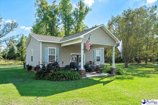 back of house featuring a lawn