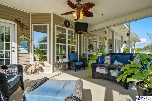 view of patio / terrace with ceiling fan and outdoor lounge area