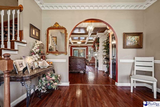 entrance foyer with beam ceiling, crown molding, coffered ceiling, and dark hardwood / wood-style flooring