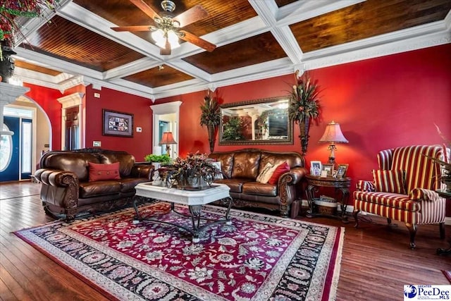 living room featuring coffered ceiling, hardwood / wood-style floors, crown molding, and ceiling fan