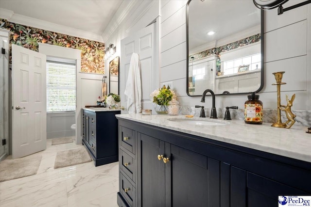 bathroom featuring crown molding, vanity, and toilet