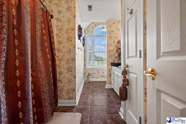 bathroom with vanity and tile patterned flooring