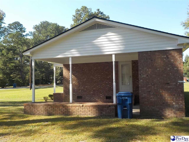 view of side of property with a yard