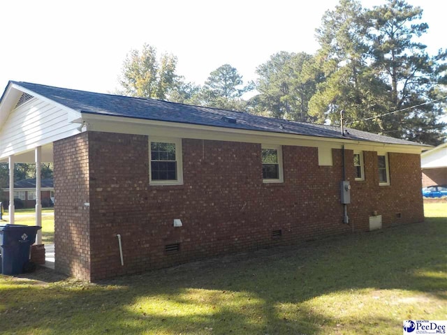 view of property exterior with a yard