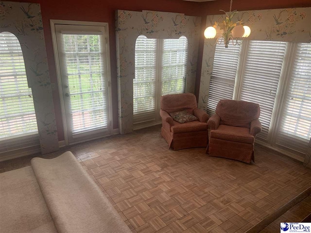 living area with a notable chandelier