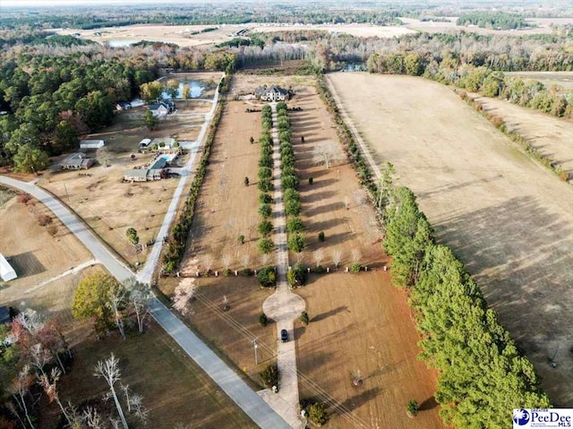 birds eye view of property with a rural view