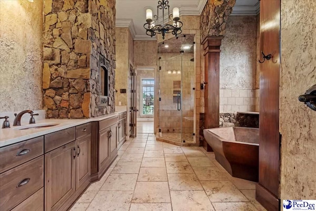 bathroom featuring an inviting chandelier, ornamental molding, independent shower and bath, and vanity