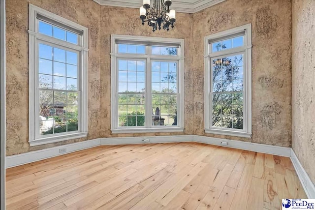 unfurnished sunroom with a chandelier