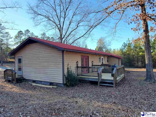 exterior space featuring a wooden deck