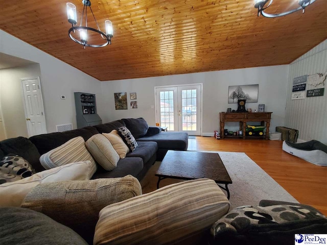 living room featuring wood ceiling, lofted ceiling, light hardwood / wood-style floors, and french doors