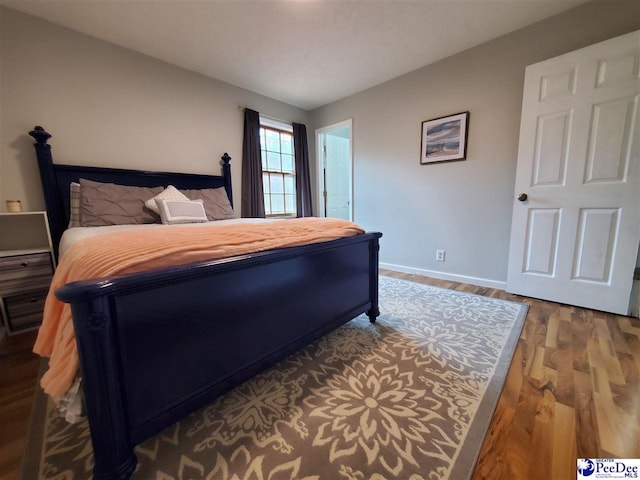 bedroom featuring hardwood / wood-style floors