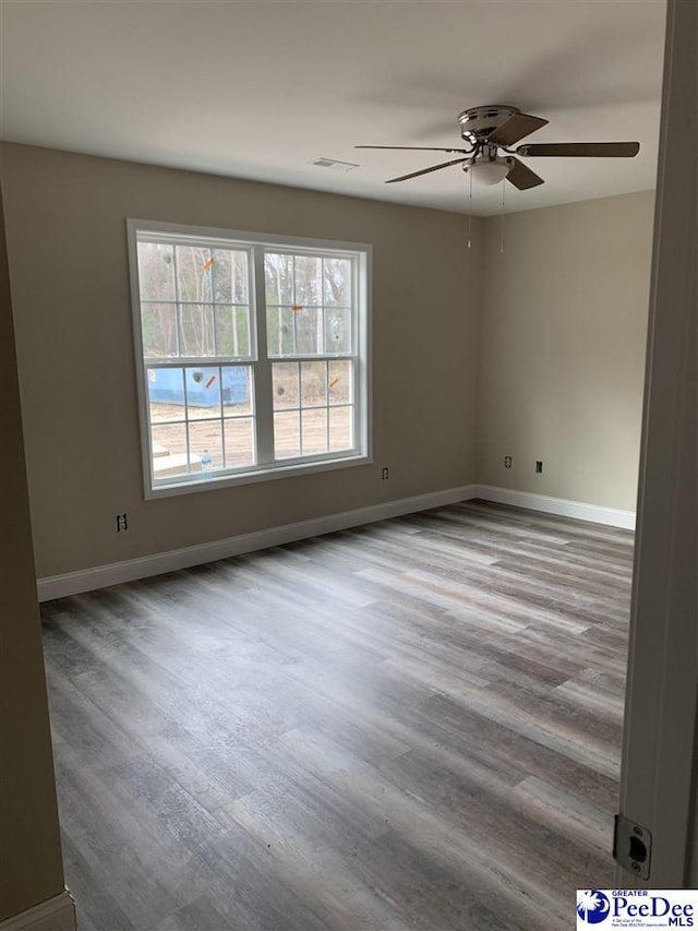 empty room featuring ceiling fan and light wood-type flooring