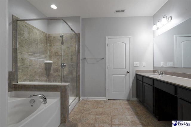 bathroom with vanity, baseboards, visible vents, a garden tub, and a stall shower