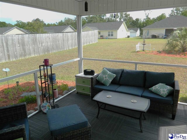 sunroom / solarium with an outdoor living space