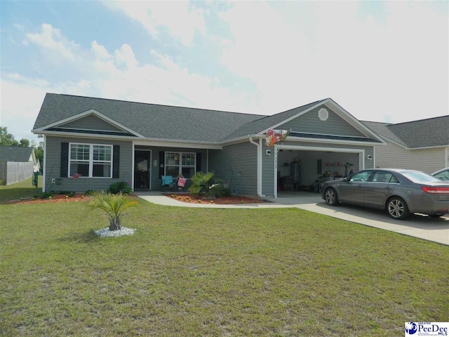 ranch-style house featuring an attached garage, a shingled roof, a front lawn, and driveway