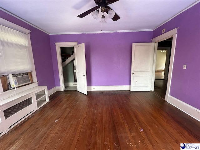 unfurnished living room featuring dark hardwood / wood-style flooring, cooling unit, ornamental molding, and ceiling fan