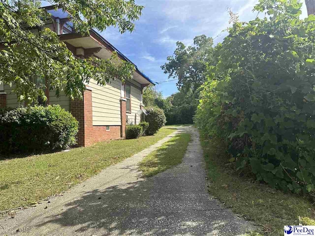 view of home's exterior featuring a yard