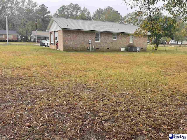 view of yard with central AC