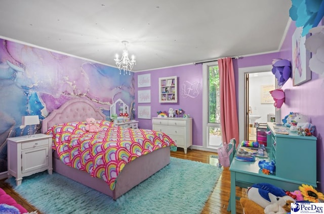 bedroom featuring a notable chandelier and light hardwood / wood-style flooring