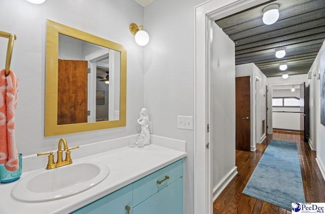 bathroom with vanity and hardwood / wood-style floors