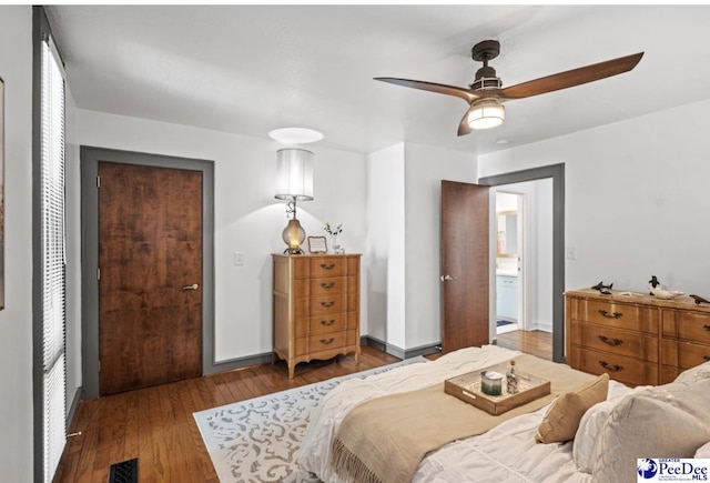 bedroom featuring ceiling fan and wood-type flooring
