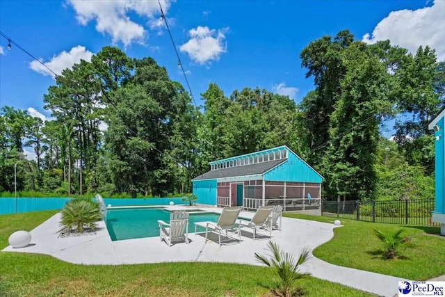 view of swimming pool with a patio area and a lawn