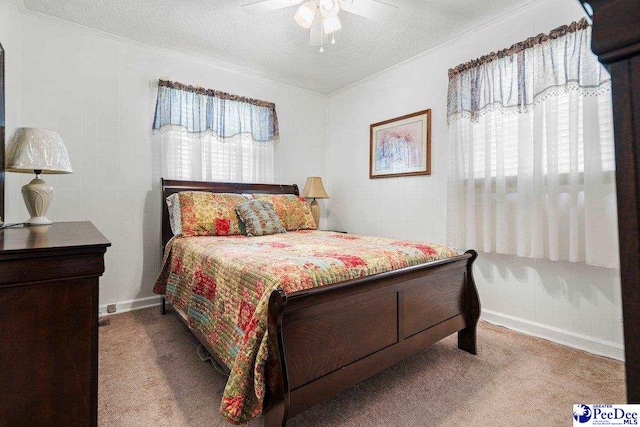 bedroom with light carpet, ceiling fan, crown molding, and a textured ceiling