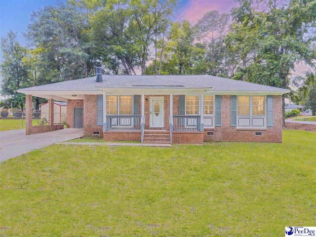 1341 Marshall Ave, Florence, SC 29501 - ranch-style house with crawl space, covered porch, driveway, and brick siding