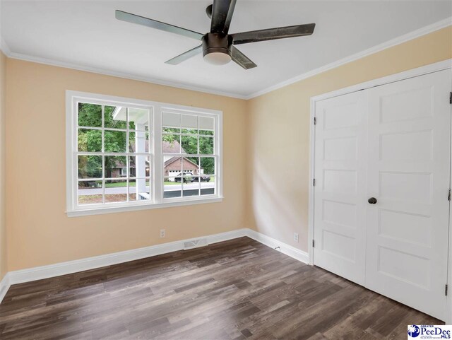 1341 Marshall Ave, Florence, SC 29501 - spare room featuring ceiling fan, dark wood-style floors, ornamental molding, and baseboards