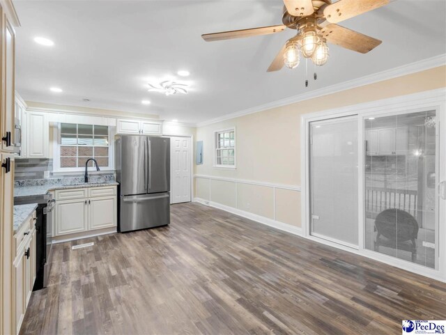 1341 Marshall Ave, Florence, SC 29501 - kitchen with freestanding refrigerator, electric range oven, crown molding, a sink, and dark wood-type flooring