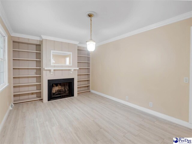 1341 Marshall Ave, Florence, SC 29501 - unfurnished living room featuring baseboards, a fireplace, wood finished floors, and crown molding