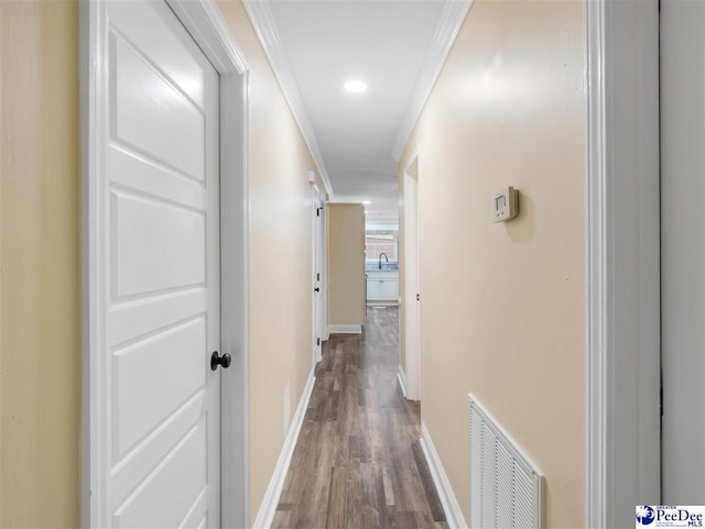 1341 Marshall Ave, Florence, SC 29501 - hall featuring dark wood finished floors, a sink, baseboards, crown molding, and recessed lighting