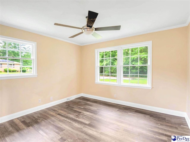 1341 Marshall Ave, Florence, SC 29501 - unfurnished room featuring healthy amount of natural light, ornamental molding, baseboards, wood finished floors, and a ceiling fan