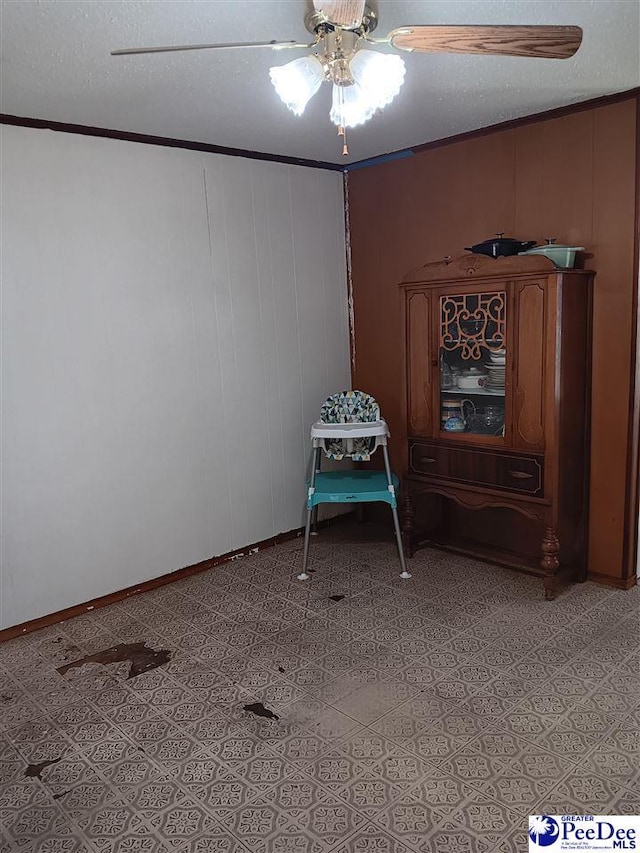 702 New Hampton Rd, Hartsville, SC 29550 - spare room featuring ceiling fan, baseboards, and crown molding