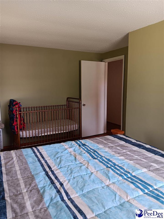 702 New Hampton Rd, Hartsville, SC 29550 - bedroom with a textured ceiling