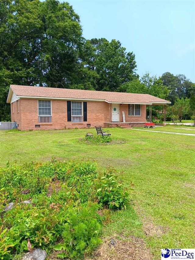 702 New Hampton Rd, Hartsville, SC 29550 - ranch-style house featuring a front yard and brick siding