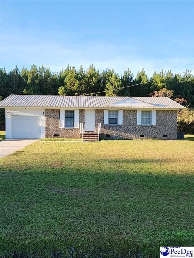 ranch-style home with a garage and a front lawn